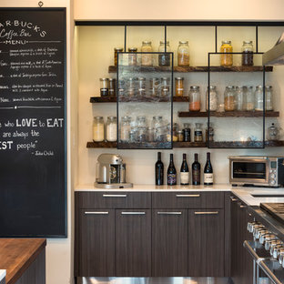 Large industrial l-shaped kitchen in Dallas with an undermount sink, flat-panel cabinets, dark wood cabinets, stainless steel appliances, with island, quartz benchtops and white benchtop.