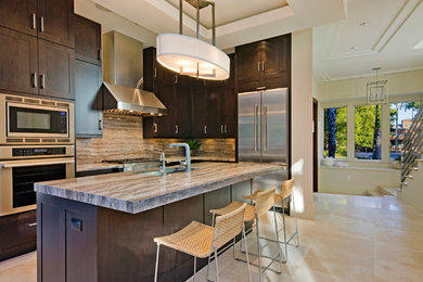 Eat-in kitchen - mid-sized transitional single-wall travertine floor eat-in kitchen idea in Miami with an undermount sink, flat-panel cabinets, dark wood cabinets, marble countertops, multicolored backsplash, stone slab backsplash, stainless steel appliances and an island