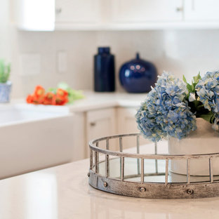 Large transitional l-shaped separate kitchen in Nashville with a farmhouse sink, shaker cabinets, white cabinets, quartz benchtops, white splashback, stone slab splashback, stainless steel appliances, medium hardwood floors, with island, blue floor and white benchtop.