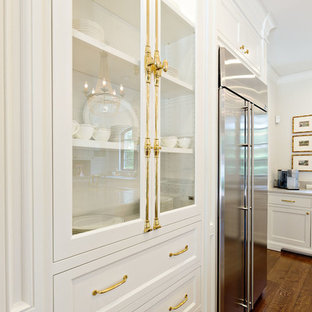Large mediterranean open concept kitchen designs - Open concept kitchen - large mediterranean u-shaped medium tone wood floor open concept kitchen idea in Orange County with a double-bowl sink, shaker cabinets, white cabinets, marble countertops, white backsplash, stone slab backsplash, stainless steel appliances and an island