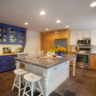 Large farmhouse enclosed kitchen ideas - Enclosed kitchen - large farmhouse u-shaped enclosed kitchen idea in Salt Lake City with an undermount sink, shaker cabinets, white backsplash, subway tile backsplash, stainless steel appliances, an island and light wood cabinets