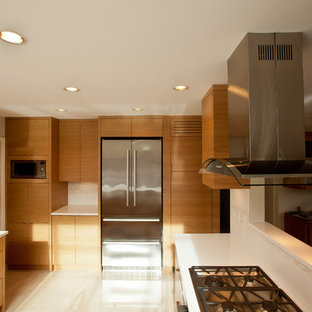 Photo of a mid-sized asian u-shaped separate kitchen in Vancouver with an undermount sink, flat-panel cabinets, light wood cabinets, quartzite benchtops, white splashback, stainless steel appliances and marble floors.