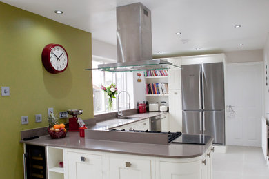 Design ideas for a small traditional l-shaped kitchen/diner in West Midlands with a built-in sink, beaded cabinets, beige cabinets, quartz worktops, grey splashback, stainless steel appliances, an island, beige floors and grey worktops.