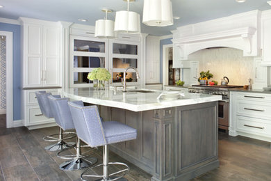 Example of a mid-sized trendy l-shaped terrazzo floor and gray floor eat-in kitchen design in Other with an undermount sink, white cabinets, quartz countertops, multicolored backsplash, stone tile backsplash, stainless steel appliances, an island and white countertops