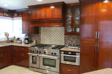 Photo of a traditional kitchen in Houston with multi-coloured splashback and glass tiled splashback.