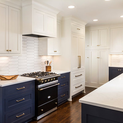 Example of a mid-sized transitional galley dark wood floor and brown floor eat-in kitchen design in Minneapolis with an undermount sink, shaker cabinets, white cabinets, quartz countertops, white backsplash, ceramic backsplash, paneled appliances and no island