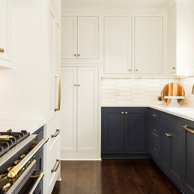 Eat-in kitchen - mid-sized transitional u-shaped dark wood floor and brown floor eat-in kitchen idea in Minneapolis with an undermount sink, shaker cabinets, white cabinets, quartz countertops, white backsplash, ceramic backsplash, paneled appliances and no island