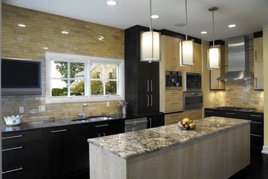 Inspiration for a large contemporary l-shaped dark wood floor eat-in kitchen remodel in Cleveland with an undermount sink, flat-panel cabinets, black cabinets, granite countertops, brown backsplash, subway tile backsplash, stainless steel appliances and an island