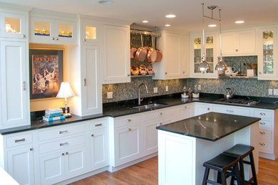 Eat-in kitchen - transitional l-shaped eat-in kitchen idea in Portland with an undermount sink, white cabinets, soapstone countertops, an island and stainless steel appliances