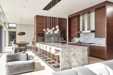Example of a large trendy l-shaped porcelain tile and white floor eat-in kitchen design in Seattle with an undermount sink, flat-panel cabinets, dark wood cabinets, marble countertops, gray backsplash, stone slab backsplash, stainless steel appliances, an island and gray countertops