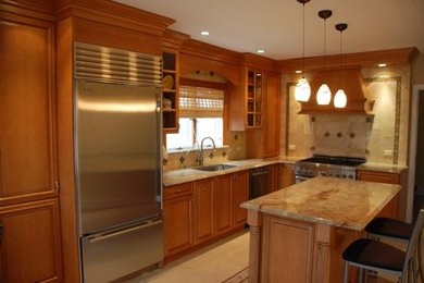 Mid-sized elegant l-shaped ceramic tile and beige floor eat-in kitchen photo in New York with an undermount sink, recessed-panel cabinets, medium tone wood cabinets, granite countertops, stainless steel appliances, an island, beige backsplash and stone tile backsplash