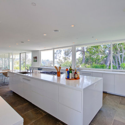Inspiration for a modern eat-in kitchen remodel in Los Angeles with an undermount sink, flat-panel cabinets and white cabinets