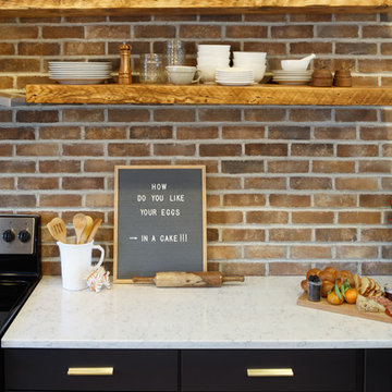 Brick Walled Kitchen with Open Shelving.