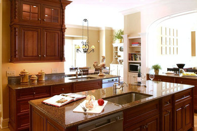 Enclosed kitchen - mid-sized contemporary u-shaped terra-cotta tile enclosed kitchen idea in New York with an undermount sink, beaded inset cabinets, dark wood cabinets, marble countertops, stainless steel appliances and an island