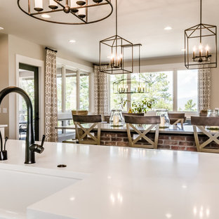 Large farmhouse open concept kitchen inspiration - Example of a large cottage u-shaped light wood floor and beige floor open concept kitchen design in Denver with a farmhouse sink, shaker cabinets, white cabinets, quartz countertops, gray backsplash, marble backsplash, stainless steel appliances, an island and white countertops
