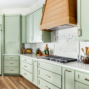  A farmhouse kitchen with green cabinets