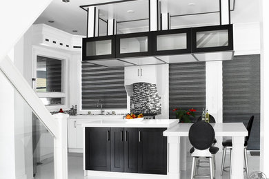 Eat-in kitchen - mid-sized modern l-shaped marble floor eat-in kitchen idea in Vancouver with an undermount sink, shaker cabinets, white cabinets, marble countertops, gray backsplash, glass sheet backsplash, stainless steel appliances and an island