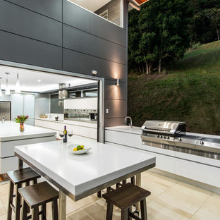 Modelo de cocina contemporánea con armarios con paneles lisos