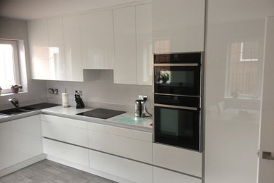 This is an example of a contemporary kitchen in West Midlands.