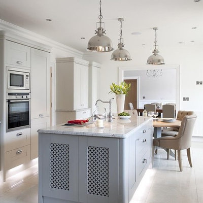Transitional eat-in kitchen photo in Belfast with shaker cabinets, gray cabinets and stainless steel appliances