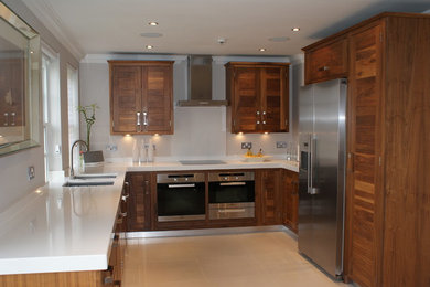 This is an example of a contemporary u-shaped kitchen in London.