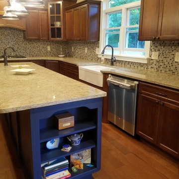 Brown and Blue Kitchen by New Creation Interiors