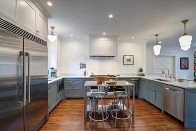Eat-in kitchen - mid-sized contemporary l-shaped dark wood floor and brown floor eat-in kitchen idea in Oklahoma City with an undermount sink, shaker cabinets, gray cabinets, quartz countertops, white backsplash, ceramic backsplash, stainless steel appliances and a peninsula