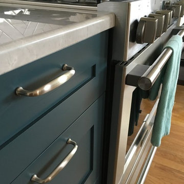 Brushed nickel drawer hardware accenting the drawers