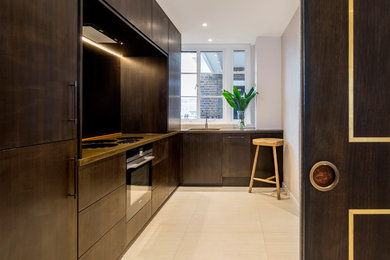 Photo of a contemporary l-shaped kitchen in London.