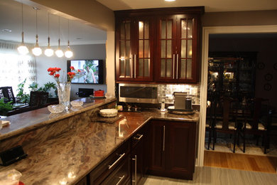 Inspiration for a mid-sized transitional galley porcelain tile enclosed kitchen remodel in Chicago with an undermount sink, recessed-panel cabinets, red cabinets, granite countertops, metallic backsplash, metal backsplash, stainless steel appliances and no island