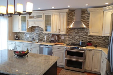 Large elegant l-shaped medium tone wood floor kitchen photo in Chicago with a double-bowl sink, raised-panel cabinets, granite countertops, glass tile backsplash, white appliances and an island