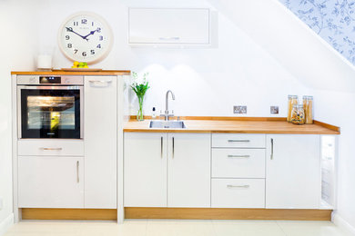 Modern kitchen in Buckinghamshire with wood worktops.