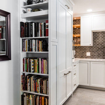 Built-In Bookshelf and Transom from the Kitchen Tile to Living Room Wood Floor