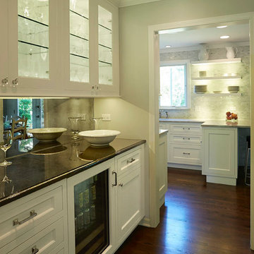 Butler's Pantry with Glass Cabinets and Mirrored Backsplash