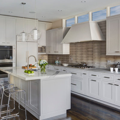 Mid-sized transitional l-shaped dark wood floor eat-in kitchen photo in Chicago with an undermount sink, shaker cabinets, gray cabinets, gray backsplash, stainless steel appliances, an island, onyx countertops and glass tile backsplash