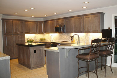 Transitional kitchen photo in Miami with gray cabinets