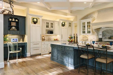Example of a large farmhouse l-shaped medium tone wood floor and brown floor eat-in kitchen design in Other with an undermount sink, recessed-panel cabinets, white cabinets, marble countertops, gray backsplash, matchstick tile backsplash, paneled appliances, an island and white countertops