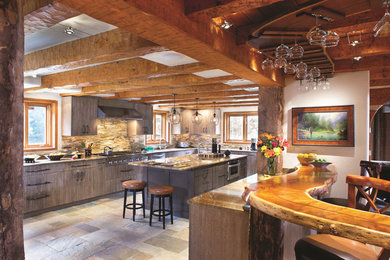 Photo of a medium sized rustic u-shaped kitchen in Los Angeles with a submerged sink, flat-panel cabinets, medium wood cabinets, marble worktops, beige splashback, mosaic tiled splashback, stainless steel appliances and multiple islands.