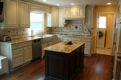 Kitchen photo in Chicago with medium tone wood cabinets, granite countertops and beige countertops