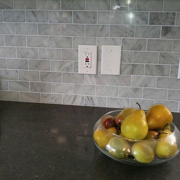 Caesarstone Piatra Grey Quartz Countertop with Carrara Marble Subway Tile