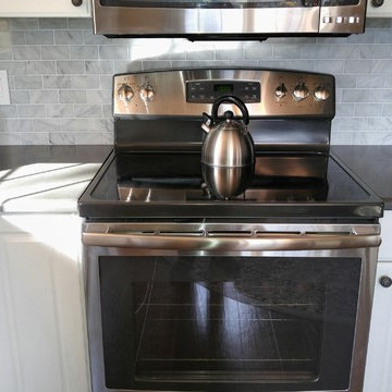 Caesarstone Piatra Grey Quartz Countertop with Carrara Marble Subway Tile