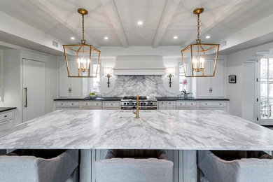 Inspiration for a timeless kitchen remodel in Dallas with marble countertops and an island