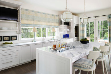 Mid-sized trendy galley kitchen photo in Atlanta with flat-panel cabinets, white cabinets, marble countertops and white countertops