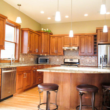 Calico Hickory cabinets with Brown Sugar stain and Golden Crystal granite