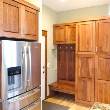 Calico Hickory cabinets with Brown Sugar stain and Golden Crystal granite