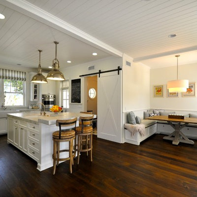 Inspiration for a coastal l-shaped dark wood floor open concept kitchen remodel in Los Angeles with a single-bowl sink, recessed-panel cabinets, cement tile backsplash and an island