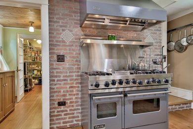 Inspiration for a large timeless coffered ceiling kitchen remodel in Boston with a farmhouse sink, shaker cabinets, red backsplash, brick backsplash, stainless steel appliances and no island