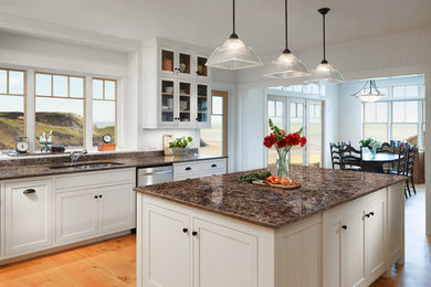 Large transitional l-shaped light wood floor eat-in kitchen photo in Phoenix with a double-bowl sink, shaker cabinets, white cabinets, marble countertops, stainless steel appliances and an island