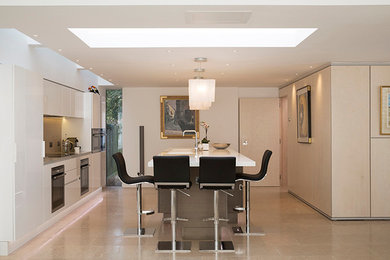 Inspiration for a contemporary kitchen in Cambridgeshire with an island.
