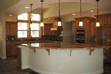 Example of a large trendy l-shaped ceramic tile eat-in kitchen design in Other with raised-panel cabinets, light wood cabinets, granite countertops and an island
